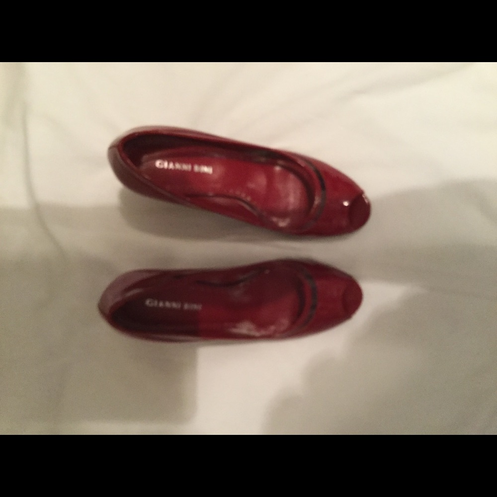 Red patent pumps worn once
